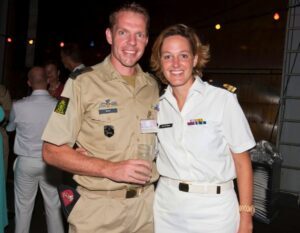 Maartje van der Maas and her husband in navy outfit