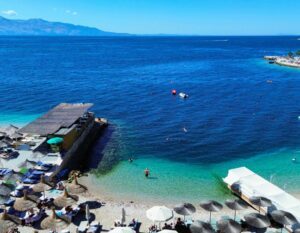 green sea with sun bed in Sarande