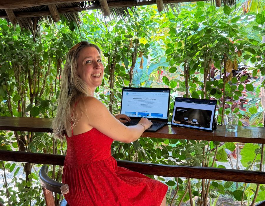 Alieke working remotely on her laptop in Kenya