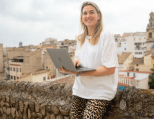 anna in spain with laptop in her hands