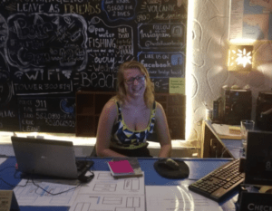 leanne at the table with her laptop