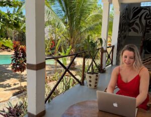 digital nomad alieke works on her laptop in Zanzibar