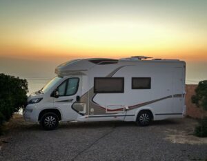 camper at the beach with sunset